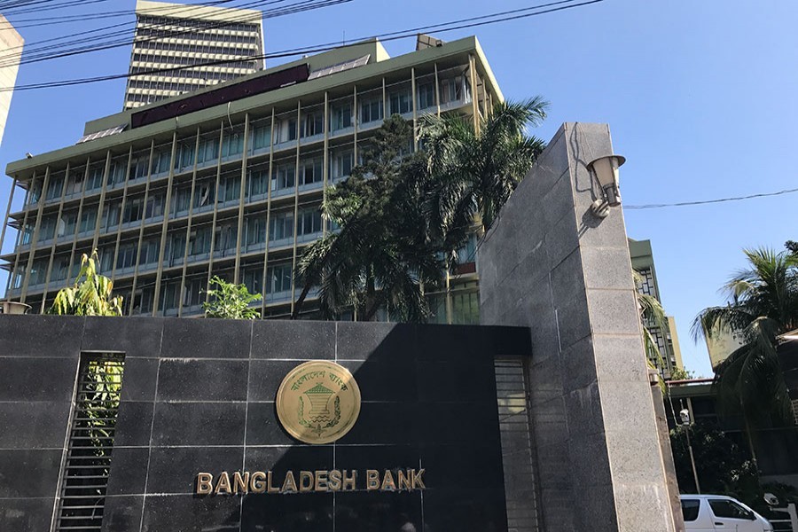 The Bangladesh Bank seal is pictured on the wall outside the central bank headquarters in Motijheel, the bustling commercial hub in capital Dhaka. FE Photo