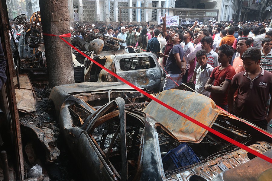 People gather at the site of a fire incident at Old Dhaka's Chawkbazar area on February 21 — FE photo