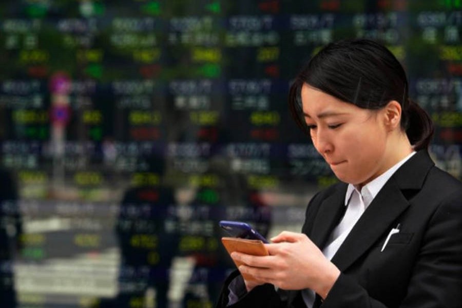Asian shares mixed in muted trading