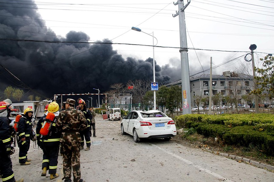 Rescue workers are seen near smoke following an explosion at a chemical industrial park in Xiangshui county, Yancheng, Jiangsu province, China — Reuters photo