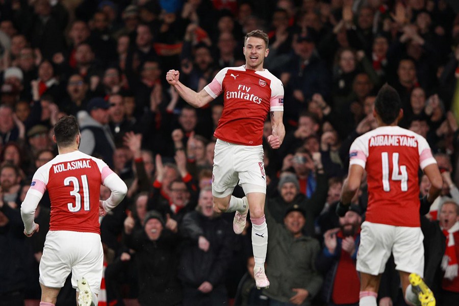 Arsenal's Aaron Ramsey celebrates scoring their first goal with Sead Kolasinac and Pierre-Emerick Aubameyang — Reuters photo