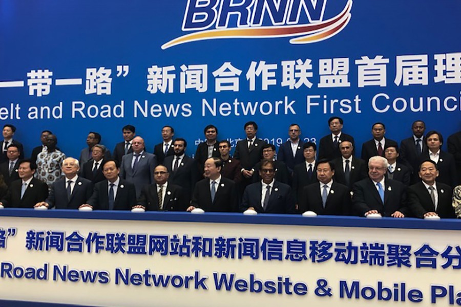 Shahiduzzaman Khan, executive editor of The Financial Express, (third from left on the back row) poses with others for photographs at the first council meeting of the Belt and Road News Network (BRNN) in Beijing on Tuesday