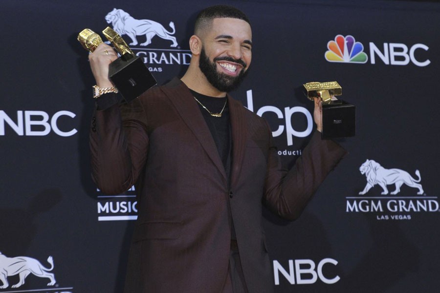 Drake poses in the press room with his awards at the Billboard Music Awards on Wednesday, May 1, 2019, at the MGM Grand Garden Arena in Las Vegas - Photo by Richard Shotwell/Invision/AP