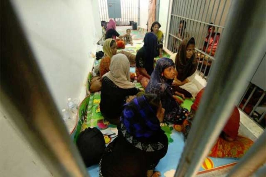 Rohingya people are seen detained in a police station after a fishing boat carrying more than sixty Rohingya refugees was found beached at Rawi island, part of Tarutao national park in the province of Satun, Thailand, bordering with Malaysia, June 12, 2019. Reuters