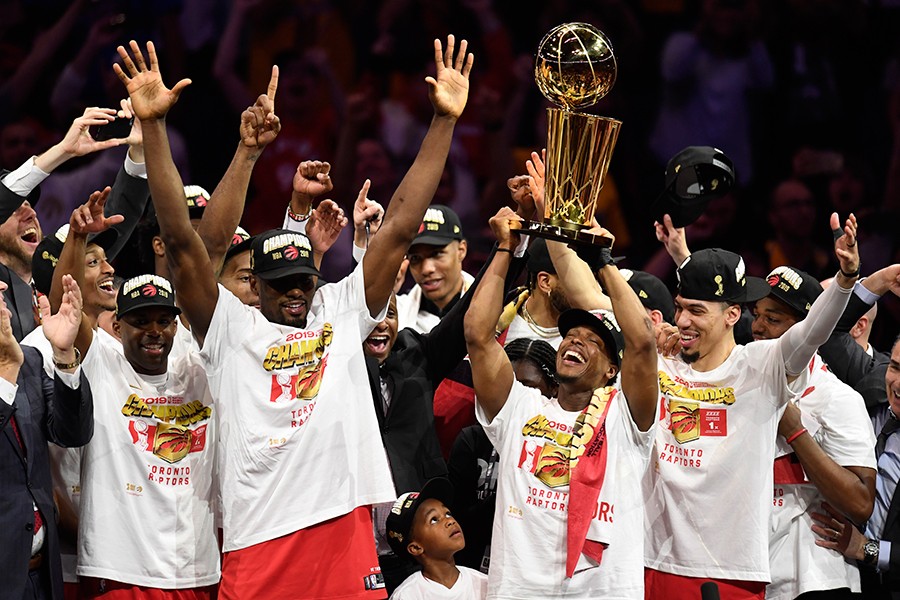 Toronto Raptors guard Kyle Lowry (centre left) holds Larry O'Brien NBA Championship Trophy after defeating the Golden State Warriors in Game six of the NBA Finals in Oakland, California, USA on Thursday, June 13, 2019 — The Canadian Press photo