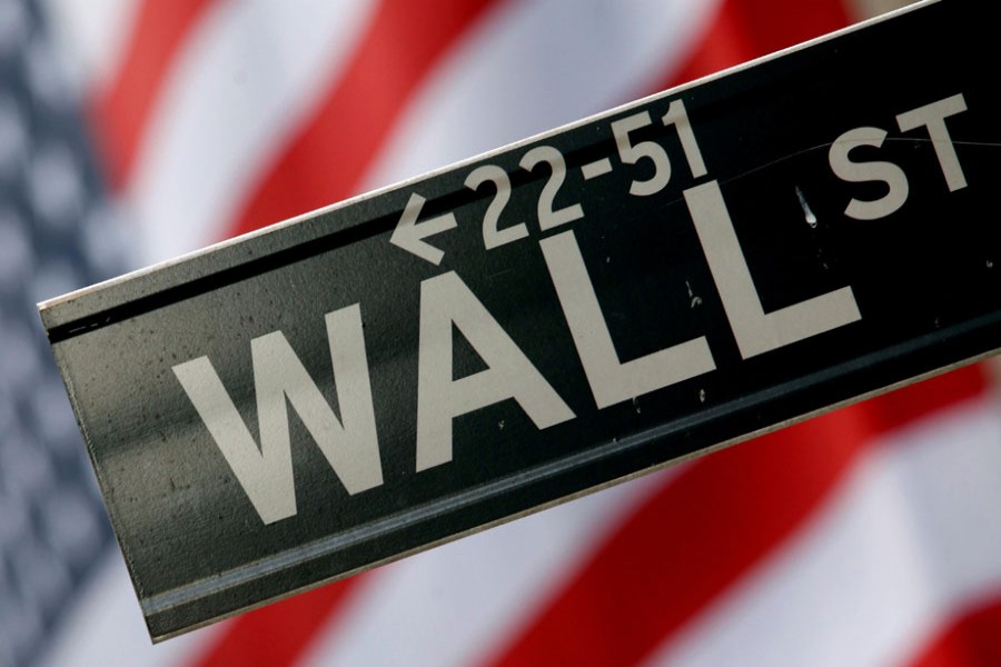 A street sign is seen in front of the New York Stock Exchange on Wall Street in New York, February 10, 2009. Reuters/File Photo