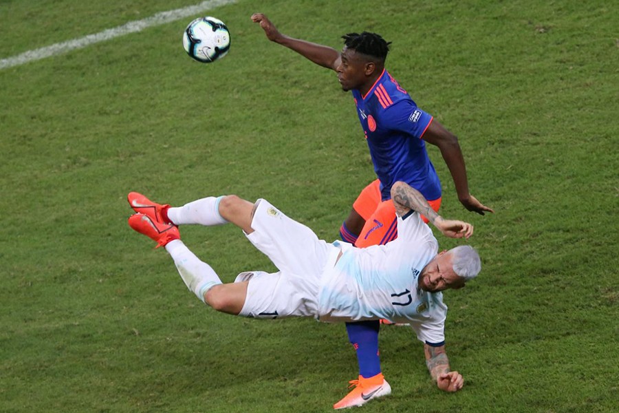 Colombia's Duvan Zapata in action with Argentina's Nicolas Otamendi — Reuters action image
