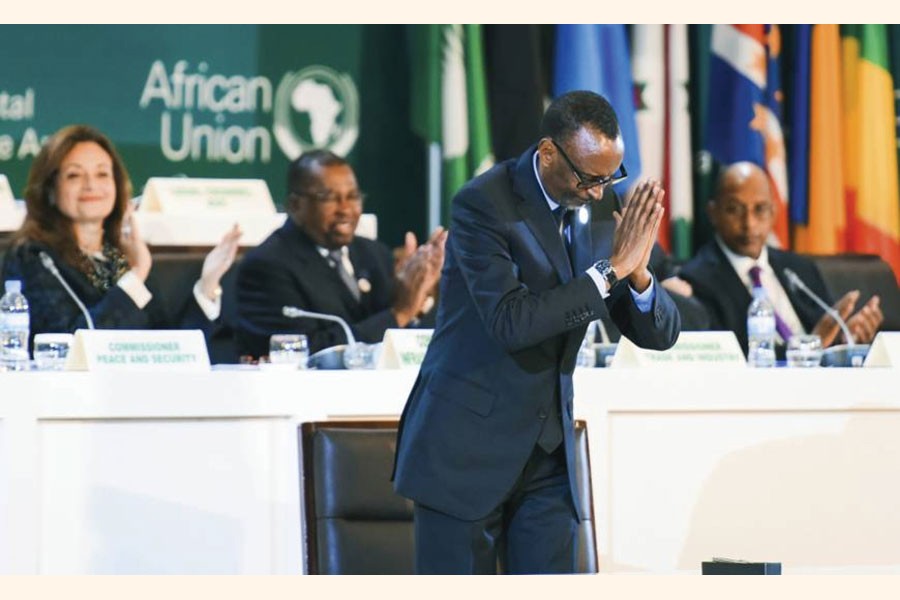 Rwandan President Paul Kagame, who was then chairman of the African Union, gestures after signing the African Continental Free Trade Area Agreement (AfCFTA) during the 10th Extraordinary Session of the AU in Kigali on March 21, 2018. AfCFTA is being called the largest free trade agreement since the creation of the World Trade Organisation.  	—Photo: AP