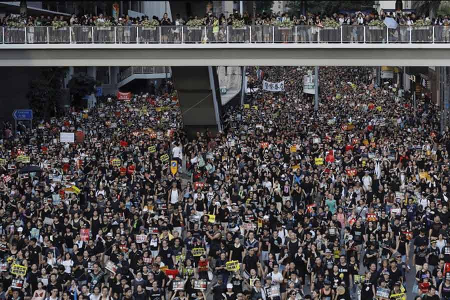 Protesters take part in a rally on Monday, July 1, 2019, in Hong Kong. Combative protesters tried to break into the Hong Kong legislature Monday as a crowd of thousands prepared to start a march in that direction on the 22nd anniversary of the former British colony's return to China. -AP Photo