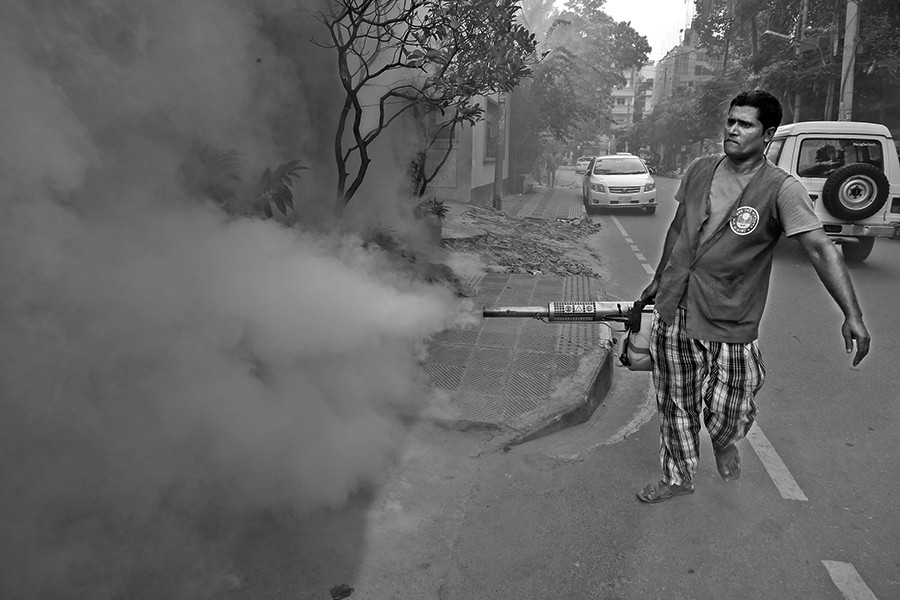 A worker of city corporation sprays anti-mosquito fog in an effort to prevent mosquitoes from breeding at a neighbourhood in Dhaka city — FE/Files