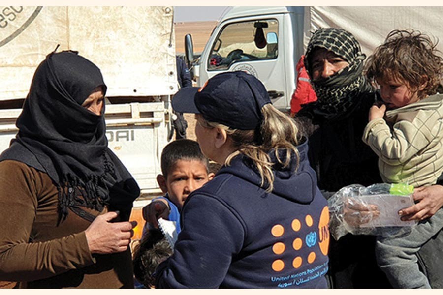 As part of the largest-ever humanitarian convoy by the United Nations and the Syrian Arab Red Crescent, UNFPA delivered on February 16, 2019 critical reproductive health supplies, hygiene and dignity kits to women and girls in the remote Rukban area of South-east Syria. Some 118 trucks brought life-saving assistance to the makeshift settlement, where more than 40,000 people are stranded in the desert. 	—Photo courtesy:  UN in Syria via the Internet