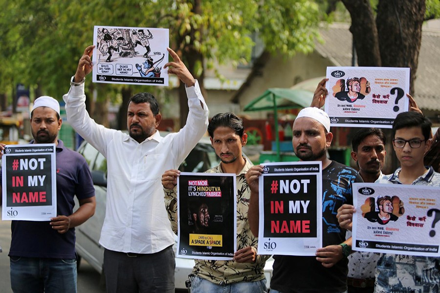 People hold placards during a protest against the lynching of Muslim man Tabrez Ansari by a Hindu mob, in Ahmedabad, India on June 26, 2019 — Reuters photo