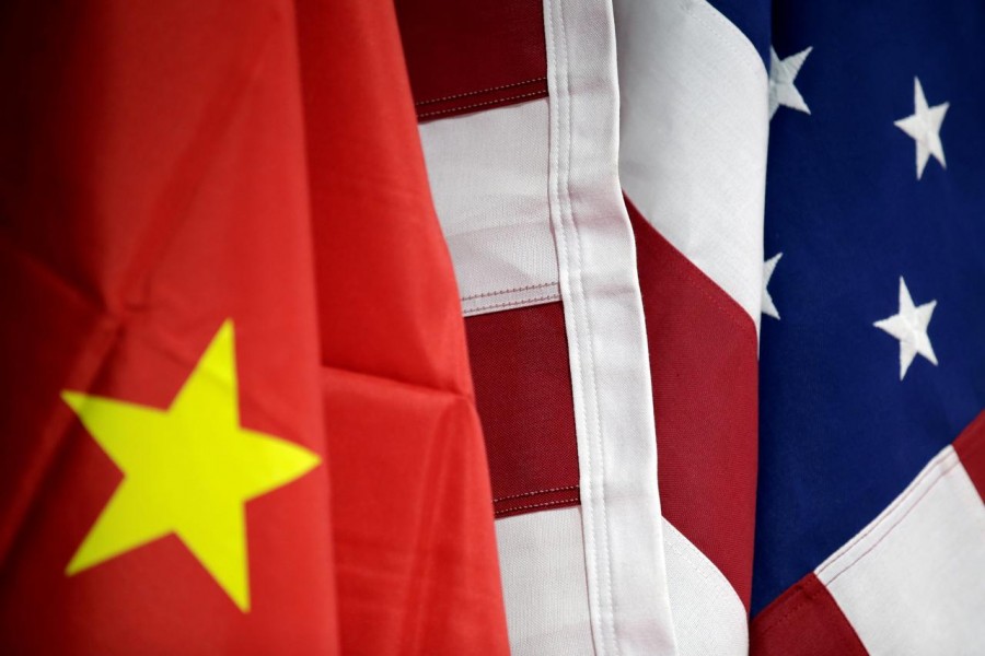 Flags of US and China are displayed at American International Chamber of Commerce (AICC)'s booth during China International Fair for Trade in Services in Beijing, China, May 28, 2019. Reuters/Files