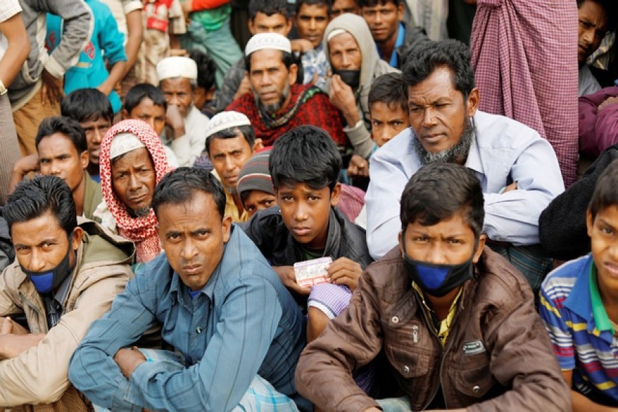 Rohingya refugees wait for food supply distribution at Balukhali camp, near Cox's Bazar, Bangladesh Jan 15, 2018. Reuters