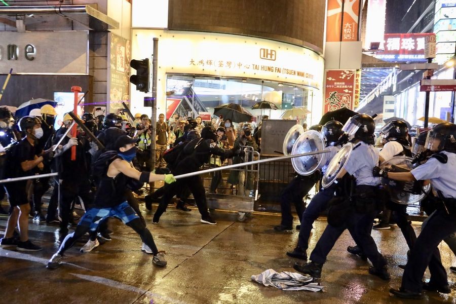 Radical protesters attack police officers in Tsuen Wan, in the western New Territories of south China's Hong Kong, Aug 25, 2019. - Xinhua