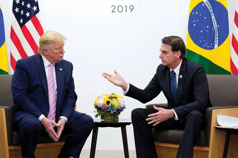 Brazil's President Jair Bolsonaro  (right) and US President Donald Trump talk during a bilateral meeting at the G20 leaders summit in Osaka, Japan on June 28, 2019. 	—Photo: Reuters