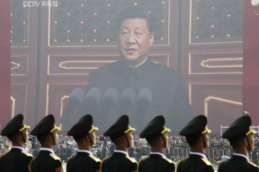 Soldiers of People's Liberation Army (PLA) are seen before a giant screen as Chinese President Xi Jinping speaks at the military parade marking the 70th founding anniversary of People's Republic of China, on its National Day in Beijing, China on October 1, 2019 — Reuters photo