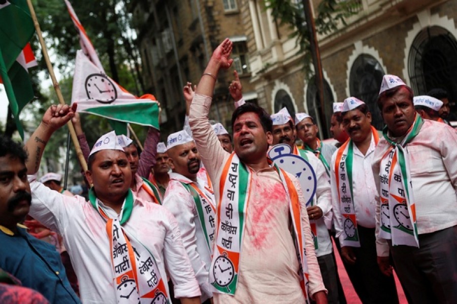 Supporters of the Nationalist Congress Party (NCP) celebrate outside the party office after learning of initial poll results in Mumbai, India, Oct 24, 2019. REUTERS