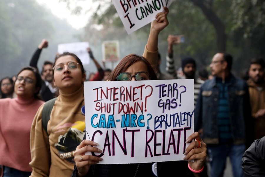 Demonstrators display placards and shout slogans during a protest against a new citizenship law, in New Delhi, India, December 19, 2019. Reuters
