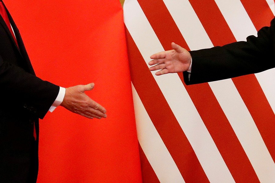 US President Donald Trump and China's President Xi Jinping shake hands after making joint statements at the Great Hall of the People in Beijing, China, November 9, 2017 — Reuters/Files