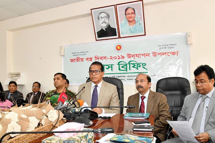 Secretary of Textiles and Jute Ministry Lokman Hossain Mia addressing a press conference at the secretariat on Tuesday. -PID Photo