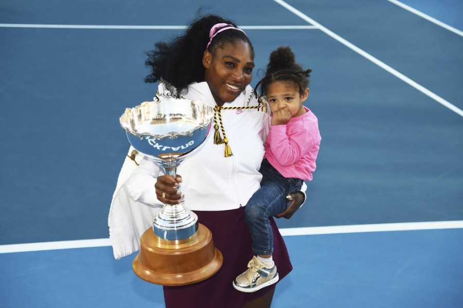 Serena Williams from the United States with daughter Alexis Olympia Ohanian Jr. and the ASB trophy after winning her singles finals match against United States Jessica Pegula at the ASB Classic in Auckland, New Zealand, Sunday, Jan 12, 2020. (Chris Symes/Photosport via AP)