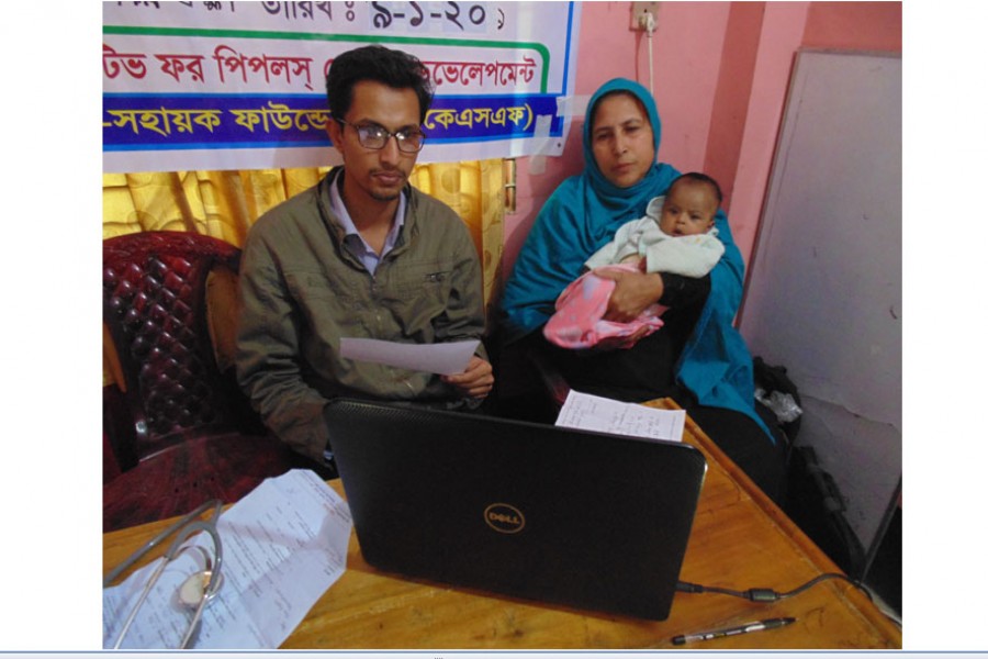 A mother is consulting a doctor through videoconferencing at an e-health camp in Shilkhali Union Parishad of Cox's Bazar recently
