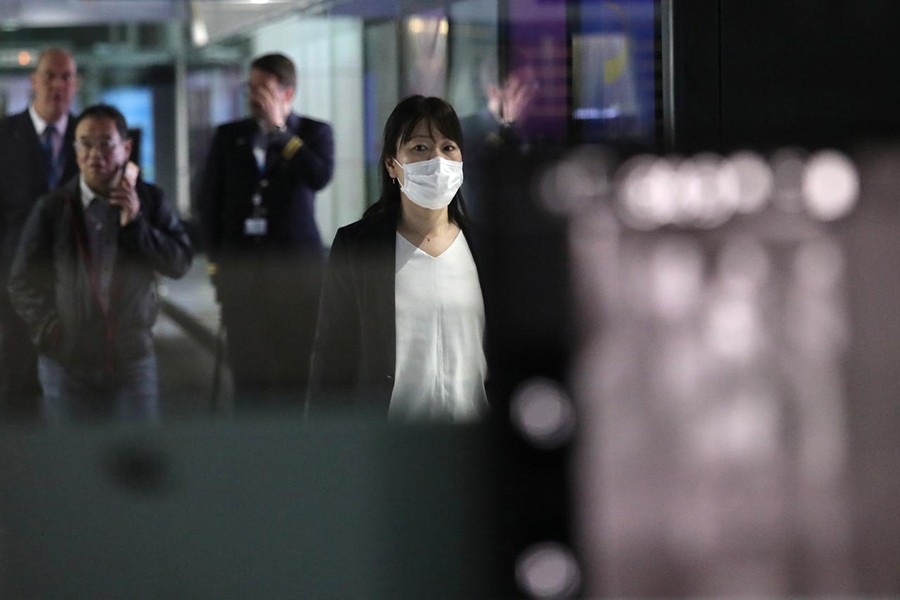A woman with mask passes by thermal screening point at international arrival terminal of Kuala Lumpur International Airport in Sepang, Malaysia on January 21, 2020 — Reuters photo