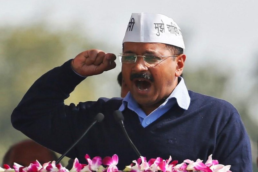 Arvind Kejriwal, chief of Aam Aadmi (Common Man) Party (AAP), addresses his supporters after taking the oath as the new chief minister of Delhi during a swearing-in ceremony at Ramlila ground in New Delhi February 14, 2015. REUTERS/Anindito Mukherjee/Files