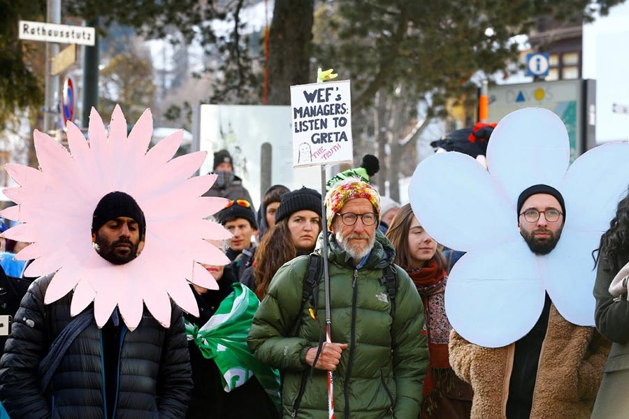 Big business says it will tackle climate change, but not how or when: Demonstration at Davos. — Image: Reuters