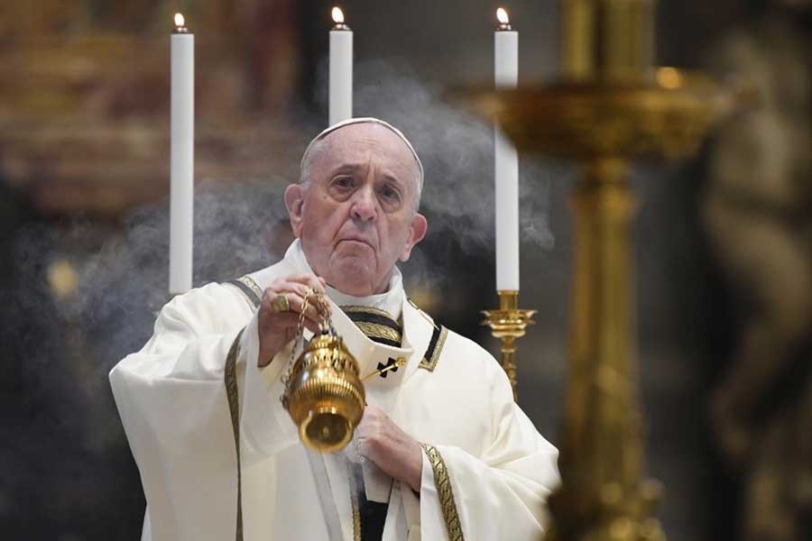 Pope Francis spreading incense at the start of Easter Sunday Mass, inside an empty St. Peter's Basilica at the Vatican on Sunday –AP Photo