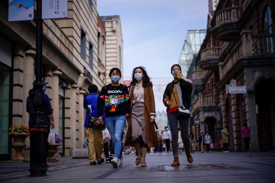People wearing face masks are seen at a main shopping area after the lockdown was lifted in Wuhan, capital of Hubei province and China's epicentre of the novel coronavirus disease (COVID-19) outbreak on April 14, 2020 — Reuters photo