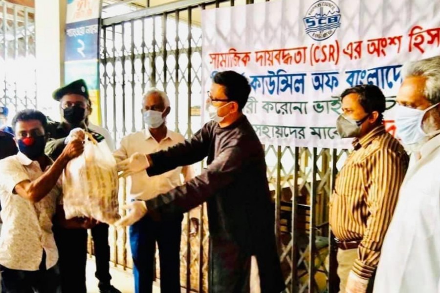 SCB distributes food among jobless port workers in Sadarghat Terminal