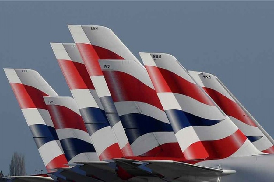 Tail Fins of British Airways planes are seen parked at the Heathrow airport as the spread of the coronavirus disease continues on Mar 31. REUTERS