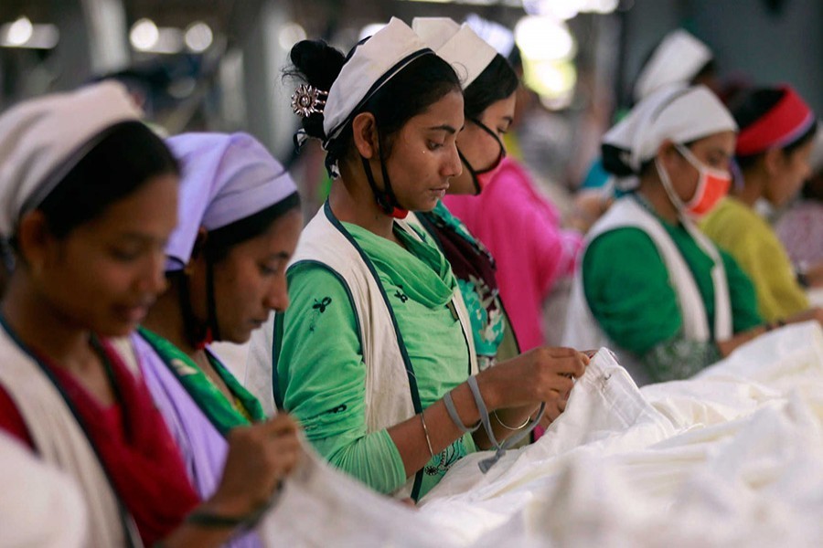 Women work at a garment factory inside the Dhaka Export Processing Zone (DEPZ) in Savar on April 11, 2013 — Reuters/Files
