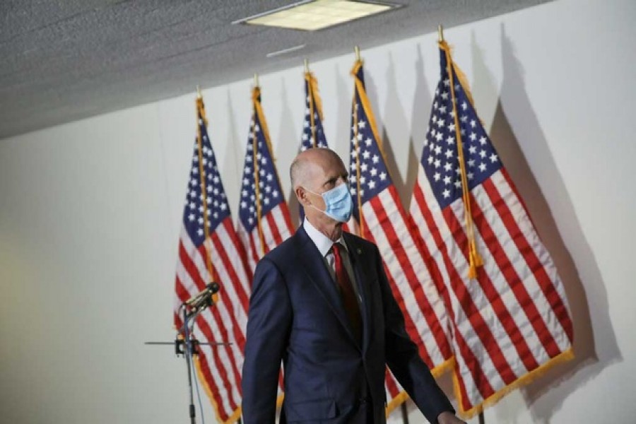 File Photo: US Senator Rick Scott (R-FL) wears a face mask during a break in a Senate Health Education Labor and Pensions Committee hearing on the coronavirus disease (COVID-19) outbreak on Capitol Hill in Washington, US, May 12, 2020. REUTERS/Carlos Barria