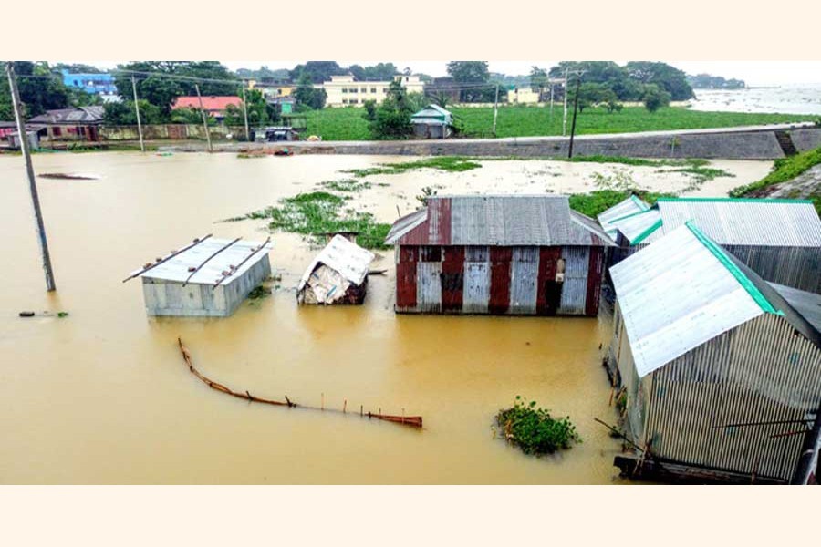 A number of houses have gone under waist-deep water for flooding in Pogla union under Kamlakanda upazila of Netrakona — FE Photo