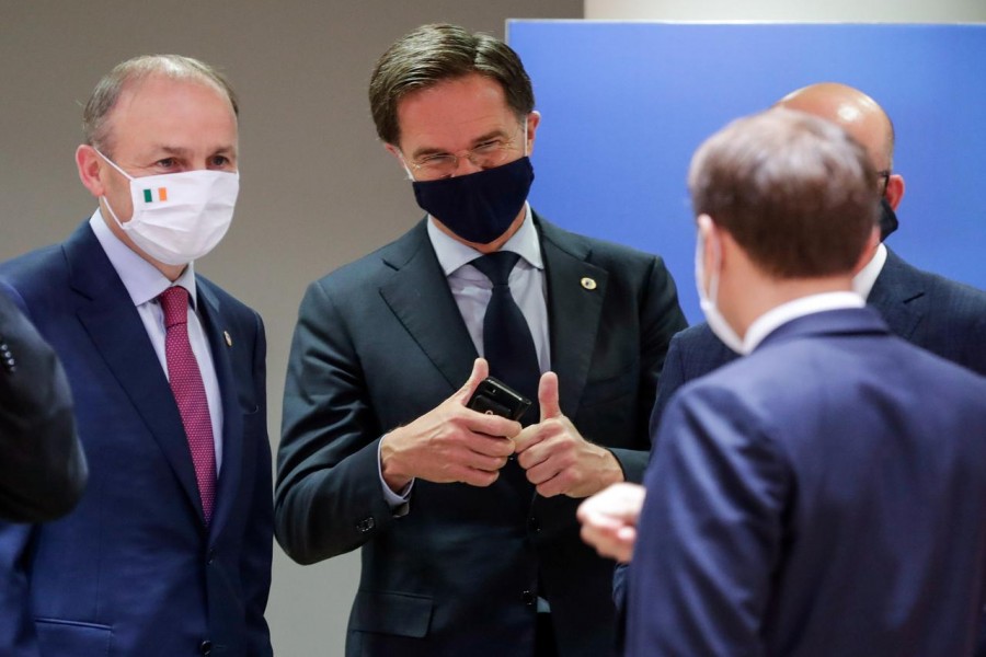 Ireland's Taoiseach Micheal Martin, Netherlands' Prime Minister Mark Rutte and France's President Emmanuel Macron interact at the last roundtable discussion following a four-day European summit at the European Council in Brussels, Belgium, July 21, 2020. Stephanie Lecocq/Pool via REUTERS