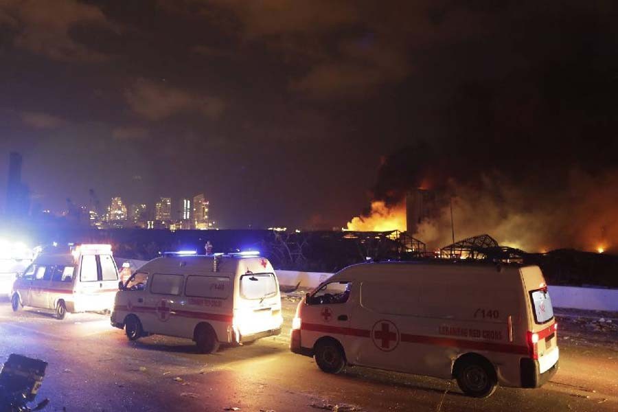 Ambulances driving past the site of a massive explosion in Beirut, Lebanon’s capital, on Tuesday –AP Photo