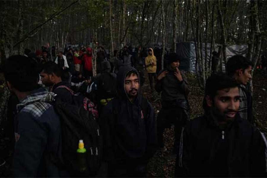 Hundreds of migrants from Asia, the Middle East and North Africa gathering before trying to cross the Bosnia-Croatia border what they call "the game", in the woods near Velika Kladusa on Wednesday –Reuters Photo
