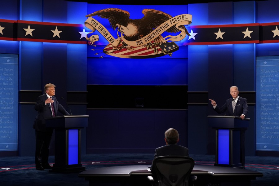 US President Donald Trump, left, and Democratic presidential candidate former Vice President Joe Biden, right, with moderator Chris Wallace of Fox News during the first presidential debate at Case Western University and Cleveland Clinic, in Cleveland, Ohio, US on September 29, 2020 — AP/Files