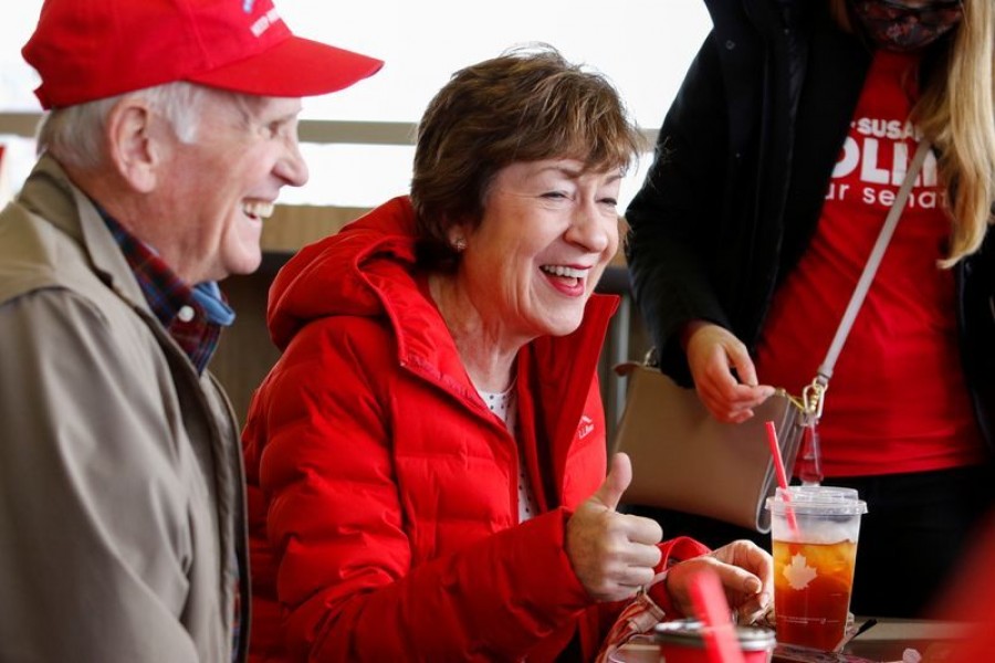 US Senator Susan Collins (R-ME), running for re-election to the US Senate, speaks with Jim Carter as she visits a Tim Horton's donut shop on Election Day in Presque Isle, Maine, US, November 3, 2020 — Reuters