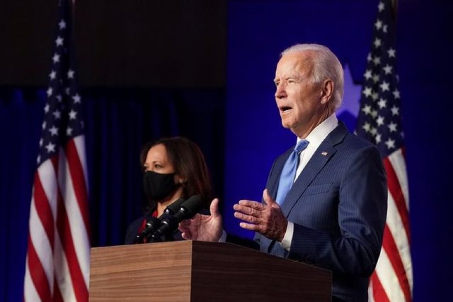 US Democratic presidential nominee Joe Biden speaks about election results, next to vice presidential nominee Kamala Harris, in Wilmington, Delaware, US, November 6, 2020 — Reuters