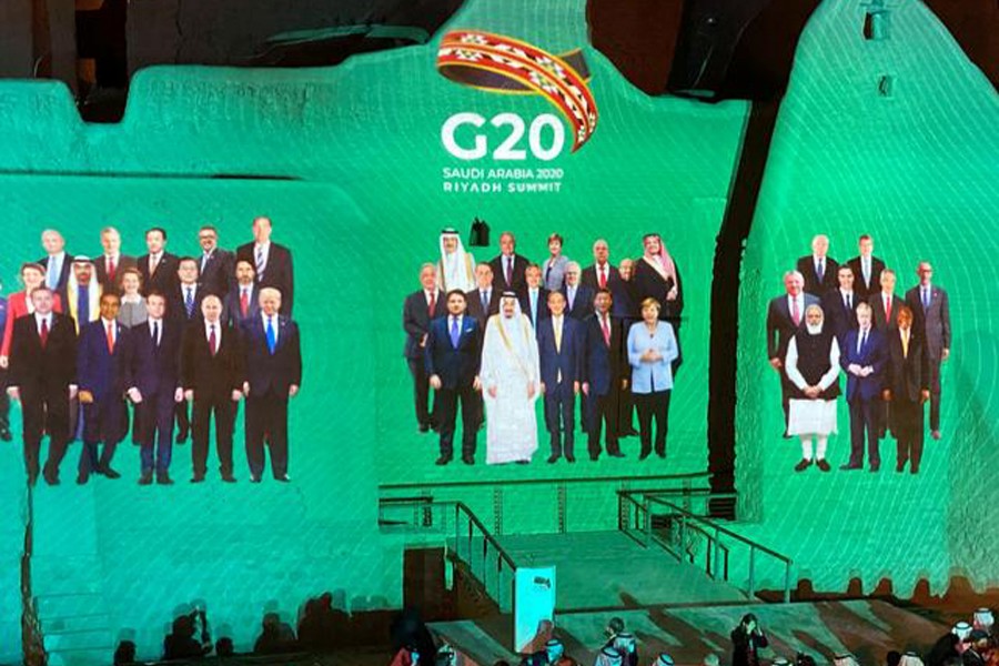 "Family Photo" for annual G20 Summit World Leaders is projected onto Salwa Palace in At-Turaif, one of Saudi Arabia's UNESCO World Heritage sites, in Diriyah, Saudi Arabia on November 20, 2020 — Reuters photo