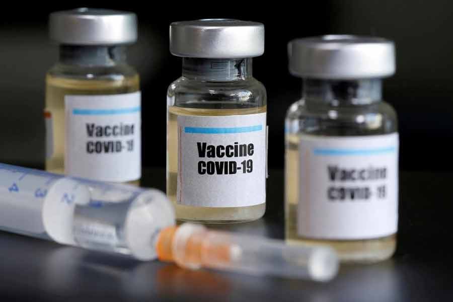 Small bottles labelled with a "Vaccine COVID-19" sticker and a medical syringe are seen in this illustration taken April 10, 2020. — Reuters/Files