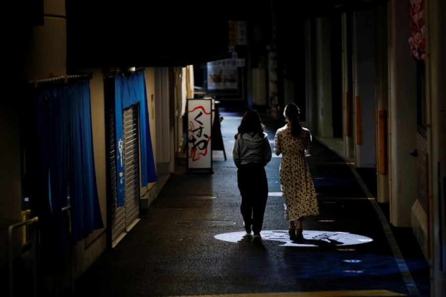 Women walk past a restaurant at a shopping district in Tokyo, amid the coronavirus disease (COVID-19) outbreak, Japan August 17, 2020. REUTERS/Kim Kyung-Hoon