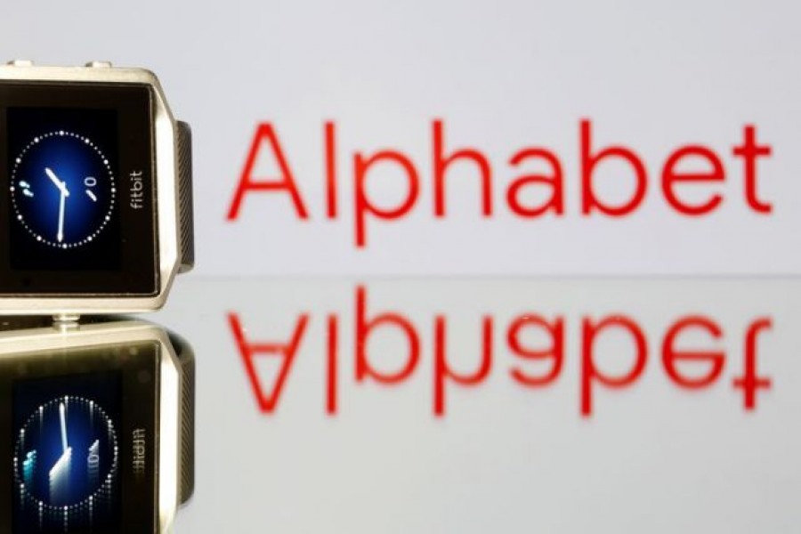 FILE PHOTO: Fitbit Blaze watch is seen in front of a displayed Alphabet logo in this illustration picture taken November 8, 2019. REUTERS