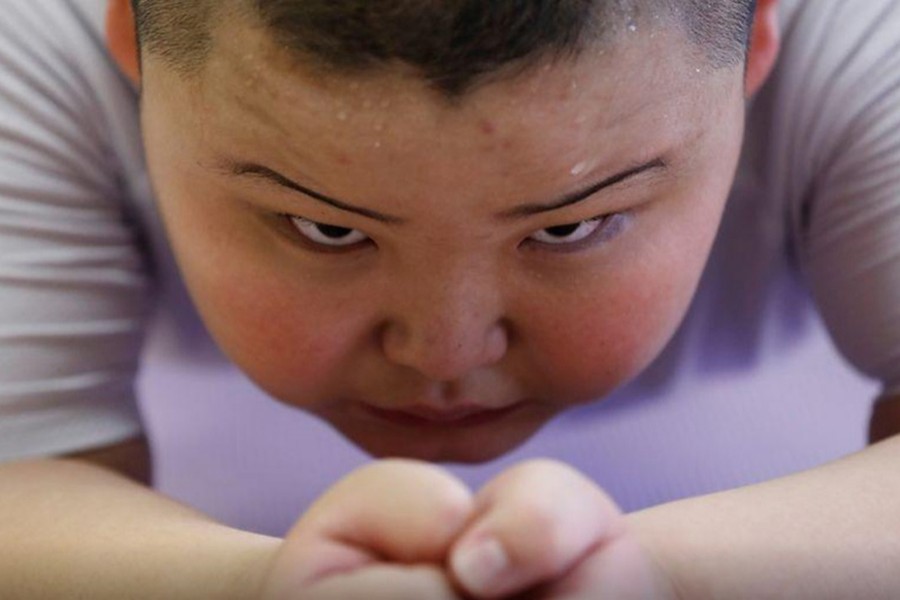Kyuta Kumagai, 10, does a plank during a one-on-one training session which his father organized at the Buddhist temple Joshin-ji in Tokyo, Japan on September 2, 2020 — Reuters/Files