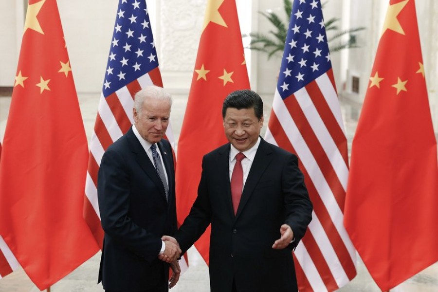 In this Dec 04, 2013, file photo, Chinese President Xi Jinping, right, shakes hands with then US Vice President Joe Biden as they pose for photos at the Great Hall of the People in Beijing — AP