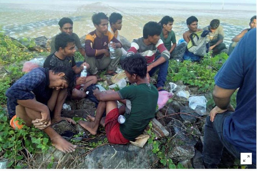FILE PHOTO: Dozens of people, believed to be Rohingya Muslims from Myanmar who were dropped off from a boat are pictured on a beach near Sungai Belati, Perlis, Malaysia in this undated handout photo released April 08, 2019. Royal Malaysian Police/Handout via REUTERS
